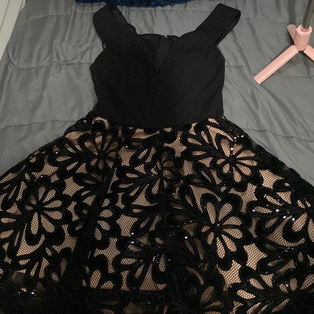 City studio nude and black dress with flowers